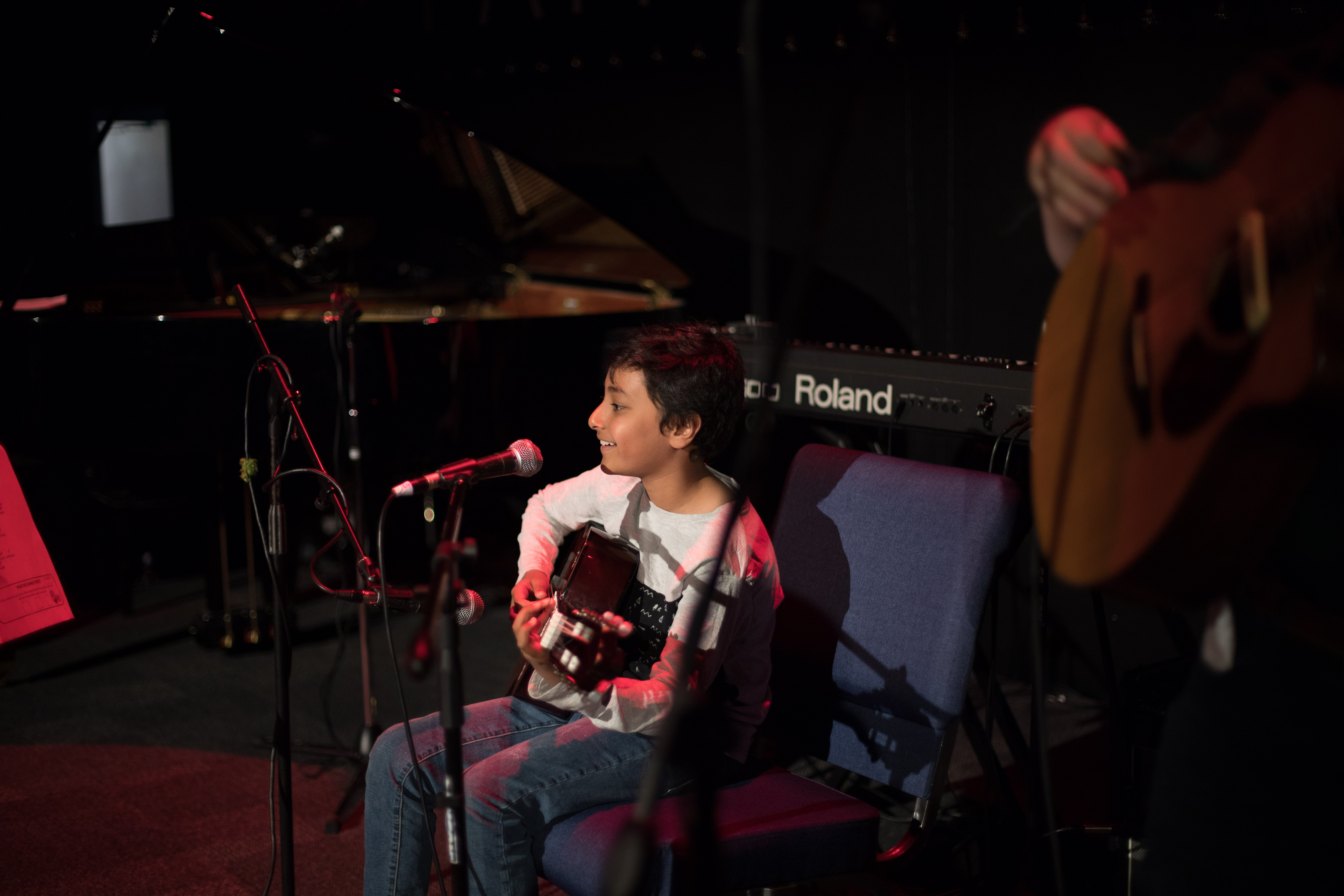 Student performing on guitar at Harborfields Music Center recital